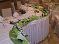 Garland made by hand with different flowers in combination with candles