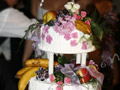 Three storey cake with fruit and flowers