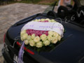 Wreath of roses on the back of the car